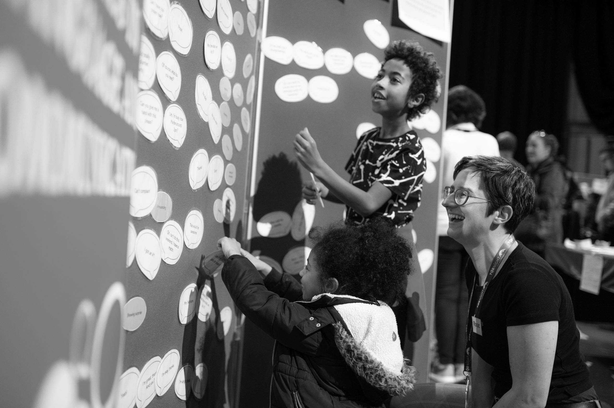 A University of York academic helps children use an interactive display as part of the research event YorNight