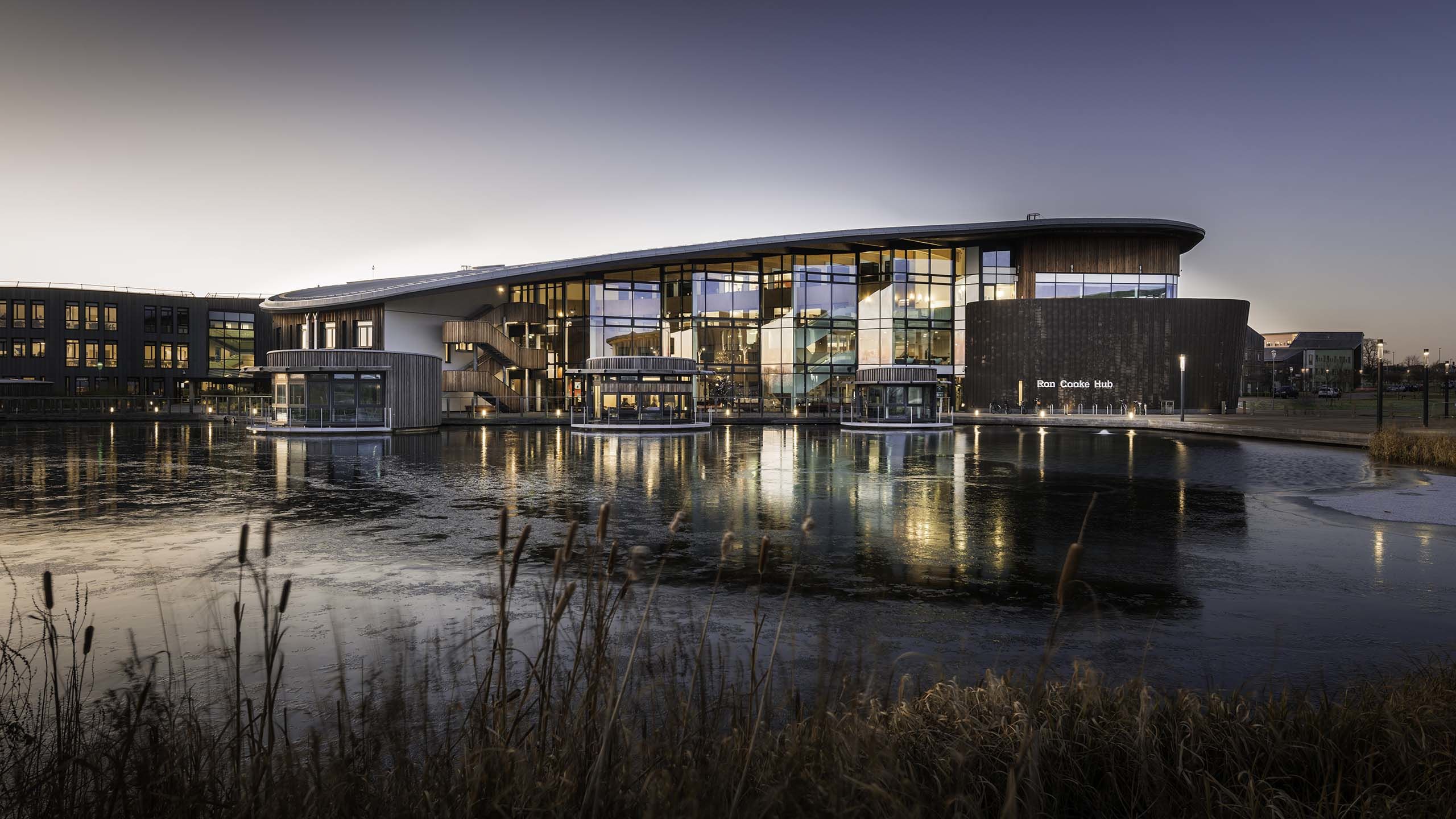 View of the Ron Cooke Hub and lake on Campus East.
