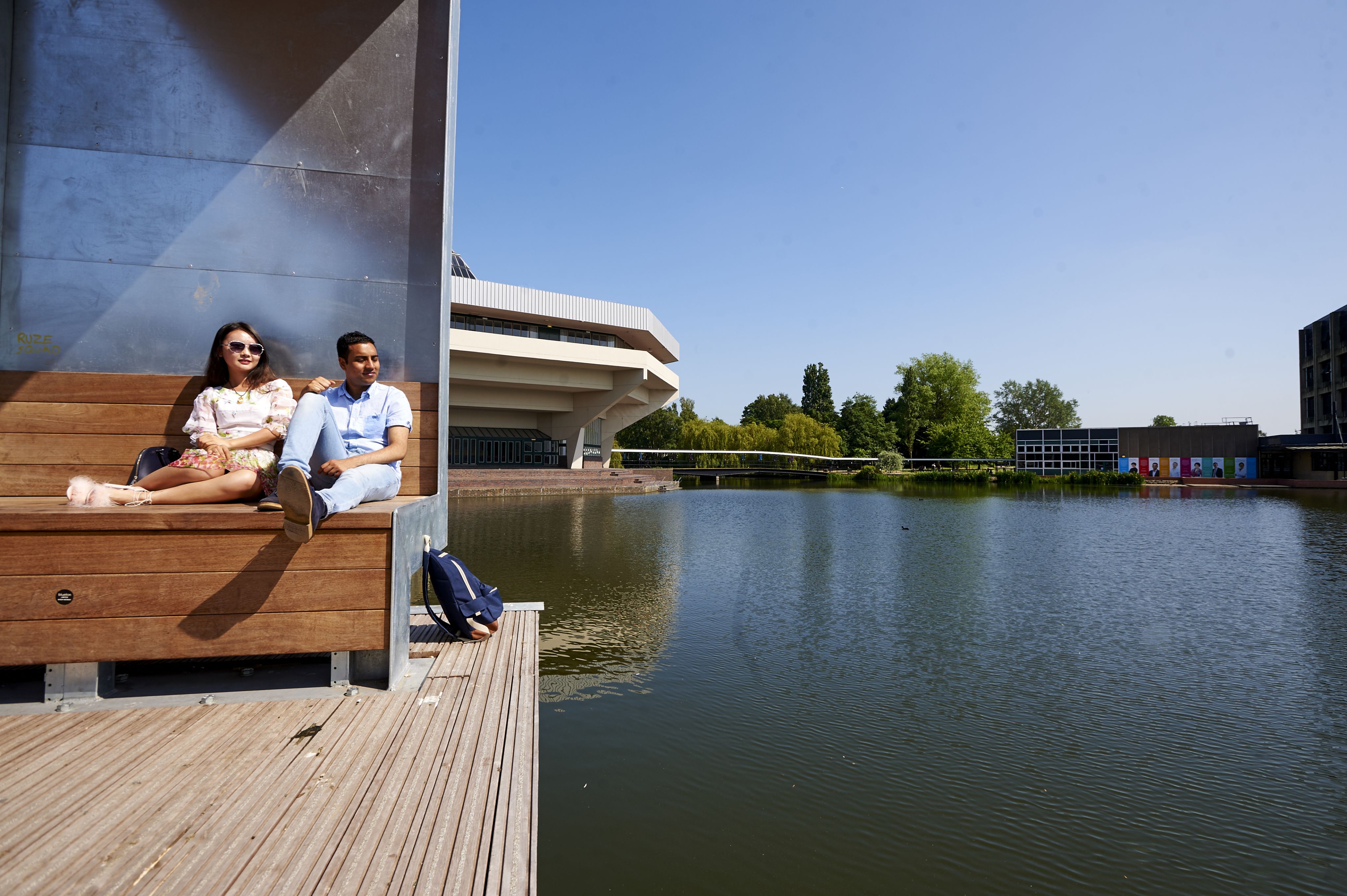 Students sat by the lake