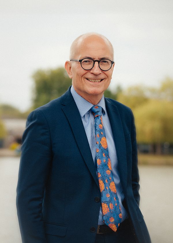 Headshot of Charlie Jeffrey in front of the lake at the University of York