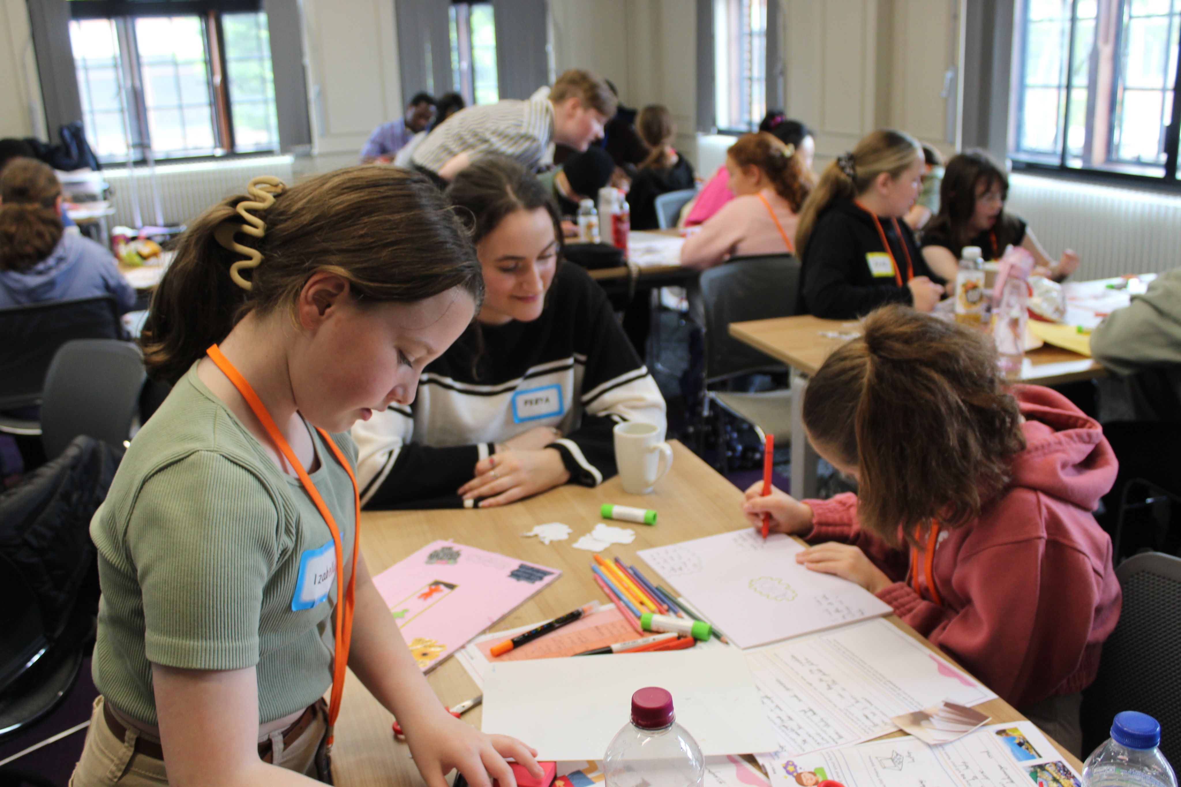 University of York students supporting group mentoring sessions with IntoUniversity